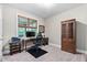 Functional home office with a desk, ergonomic chair, and ample storage space at 5209 Thistleby Rd, Fuquay Varina, NC 27526