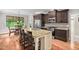 Kitchen with granite countertops, an island with barstool seating, and stainless steel appliances at 5209 Thistleby Rd, Fuquay Varina, NC 27526