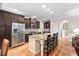 A kitchen with recessed lighting, granite countertops, stainless steel appliances, and a breakfast bar at 5209 Thistleby Rd, Fuquay Varina, NC 27526