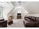 Inviting living room with plush seating, a media center, and cozy furnishings at 5209 Thistleby Rd, Fuquay Varina, NC 27526