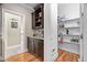Butler's pantry with granite countertops, wooden cabinets, and open shelving in a walk-in pantry at 5209 Thistleby Rd, Fuquay Varina, NC 27526