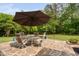 Outdoor stone patio with dining area at 5209 Thistleby Rd, Fuquay Varina, NC 27526