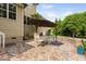 Stone patio featuring an outdoor dining set and seating area at 5209 Thistleby Rd, Fuquay Varina, NC 27526