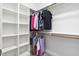 Spacious walk-in closet with custom shelving and ample hanging space at 5209 Thistleby Rd, Fuquay Varina, NC 27526