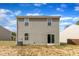 Back exterior of home, with vinyl siding, and an air conditioning unit at 536 Gusty Ln, Zebulon, NC 27597