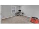 This bedroom features plush carpet flooring, neutral walls, and a convenient workspace area with a computer at 536 Gusty Ln, Zebulon, NC 27597