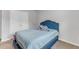 This bedroom features a closet, plush carpet flooring, neutral walls, and a bright window at 536 Gusty Ln, Zebulon, NC 27597
