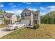 Charming two-story home with a two-car garage, neutral siding, and a well-manicured front yard at 536 Gusty Ln, Zebulon, NC 27597