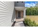 Covered front porch with stone veneer and neutral siding at 536 Gusty Ln, Zebulon, NC 27597