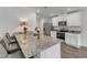 Kitchen featuring granite countertops, stainless steel appliances, island, and flowers at 536 Gusty Ln, Zebulon, NC 27597