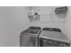 This laundry room features modern appliances and convenient overhead shelving at 536 Gusty Ln, Zebulon, NC 27597