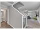 Staircase with landing that leads to a spacious open-concept living area at 536 Gusty Ln, Zebulon, NC 27597