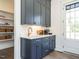 Stylish bar area with custom cabinetry and beverage center at 602 Shelley Rd, Raleigh, NC 27609