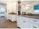 Primary bathroom with dual sinks, walk in closet, and glass enclosed shower at 602 Shelley Rd, Raleigh, NC 27609