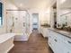 Spacious bathroom features a soaking tub, large shower, and dual vanities at 602 Shelley Rd, Raleigh, NC 27609