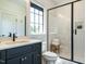 Modern bathroom featuring a sleek vanity, glass shower with niche, and stylish fixtures at 602 Shelley Rd, Raleigh, NC 27609