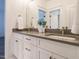 Elegant bathroom featuring double sink vanity, modern countertops and fixtures and two framed mirrors at 602 Shelley Rd, Raleigh, NC 27609