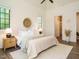 Airy bedroom featuring neutral decor, large windows, and ensuite bathroom at 602 Shelley Rd, Raleigh, NC 27609