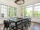 Sunlit dining room with large windows and modern chandelier at 602 Shelley Rd, Raleigh, NC 27609
