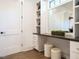 Dressing area features a vanity with a mirror and built-in shelving at 602 Shelley Rd, Raleigh, NC 27609