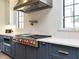 Gourmet kitchen with professional-grade range and herringbone backsplash at 602 Shelley Rd, Raleigh, NC 27609