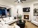 Bright living room with fireplace and seamless indoor-outdoor flow at 602 Shelley Rd, Raleigh, NC 27609