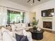 Bright living area features a fireplace, large sliding doors, and neutral decor for a cozy atmosphere at 602 Shelley Rd, Raleigh, NC 27609