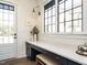 Bright mudroom with bench, cabinets, and a view to the exterior at 602 Shelley Rd, Raleigh, NC 27609
