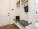 Stylish mudroom with built-in bench, storage cubbies, and coat hooks for organization and convenience at 602 Shelley Rd, Raleigh, NC 27609