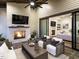 A covered patio with a fireplace, TV, and comfortable seating creates an inviting outdoor living space at 602 Shelley Rd, Raleigh, NC 27609