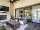 Cozy screened-in patio with fireplace and comfortable seating area at 602 Shelley Rd, Raleigh, NC 27609