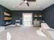 Large playroom with dark blue walls, shelves, cabinetry, and a play kitchen and structure at 602 Shelley Rd, Raleigh, NC 27609