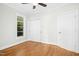 Bedroom featuring hardwood floors, a ceiling fan, and a double door closet for ample storage at 607 Smedes Place # B, Raleigh, NC 27605