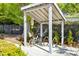 A bike rack with a covered shelter on a sunny day with two bicycles in the bike rack for resident use at 607 Smedes Place # B, Raleigh, NC 27605