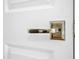 Close-up of a modern, white door with sleek, metallic handle hardware, showcasing the home's attention to detail at 607 Smedes Place # B, Raleigh, NC 27605