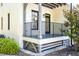 Charming porch with black metal railings, offers a cozy outdoor space with painted white and grey trim at 607 Smedes Place # B, Raleigh, NC 27605