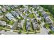 Residential neighborhood with tidy lawns, mature trees, and solar-equipped homes, offering a blend of comfort and modernity at 704 Moonbeam Dr, Raleigh, NC 27603