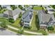 Aerial view of home with solar panels, manicured lawn, and neighborhood setting at 704 Moonbeam Dr, Raleigh, NC 27603