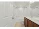 Bathroom featuring tiled floor, double sink, shower, tub and toilet at 704 Moonbeam Dr, Raleigh, NC 27603