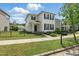 Charming two-story home with black shutters, black fence, and lush green lawn at 704 Moonbeam Dr, Raleigh, NC 27603