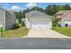 A two-car detached garage and concrete driveway offer parking at 704 Moonbeam Dr, Raleigh, NC 27603