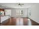 An open concept floor plan features hardwood floors, natural light and a kitchen island at 704 Moonbeam Dr, Raleigh, NC 27603