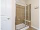 A bathroom showcasing a tiled glass door shower with a built-in seat at 7229 Terregles Dr, Raleigh, NC 27617