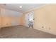 This attic room has neutral carpet and walls, a door to the hallway, and a compact storage area at 7940 Milltrace Run, Raleigh, NC 27615