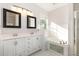Bathroom featuring double vanity, soaking tub, and tiled floors at 7940 Milltrace Run, Raleigh, NC 27615