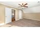 Standard bedroom with carpet, ceiling fan, and closet space at 7940 Milltrace Run, Raleigh, NC 27615