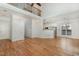 Spacious open concept living area with hardwood floors, great lighting, and an upstairs balcony at 7940 Milltrace Run, Raleigh, NC 27615