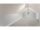 Finished attic space with gray carpet, a window, and track lighting at 84 N Hadrian Ct, Clayton, NC 27520