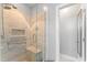 Newly renovated shower with glass door and built-in seating at 84 N Hadrian Ct, Clayton, NC 27520