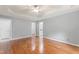 Spacious primary bedroom boasts natural lighting, hardwood floors, and ensuite bathroom at 84 N Hadrian Ct, Clayton, NC 27520